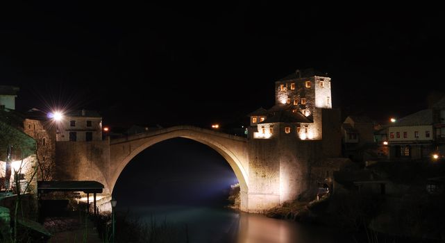 Old Bridge in Mostar at night reconstructed in 2003 after the original from 1556.