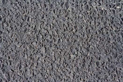 close up of parking lot asphalt black texture background