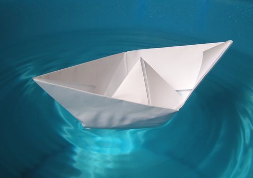 Paper ship in water
