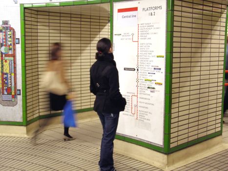 Girl wallking in the London Tube underground