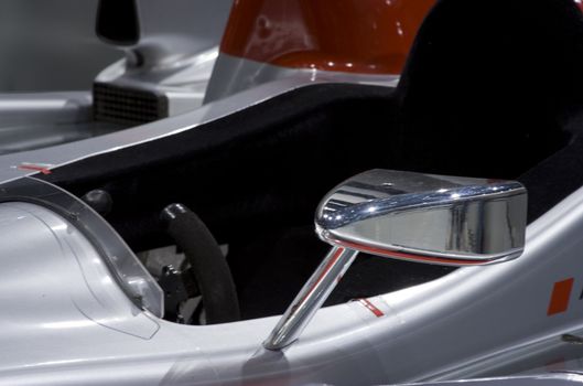 Close up of cockpit of a race car silver black 