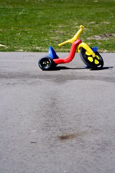 Childhood red and yellow plastic tricycle big front wheel