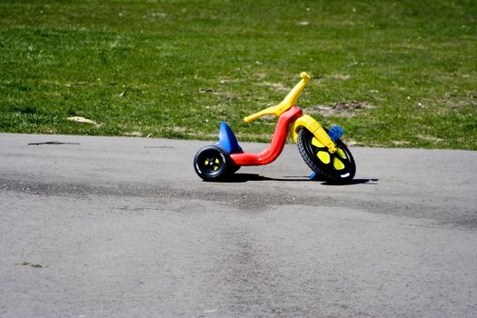 Childhood red and yellow plastic tricycle big front wheel