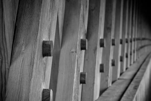 the lumber used to build an covered bridge close up of the detail, then fading to blur