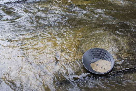 gold panning iin a small stream in northern michigan