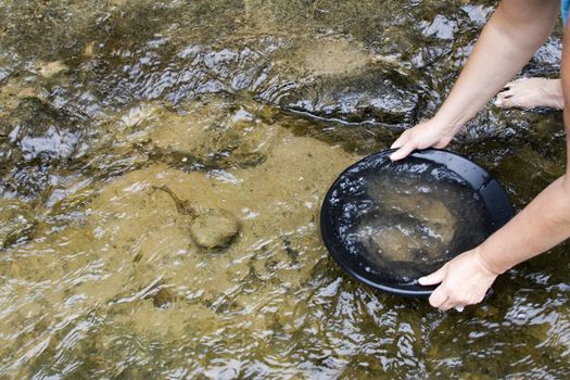 gold panning iin a small stream in northern michigan