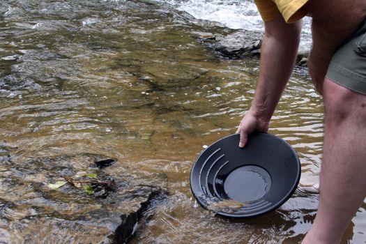 Panning for gold in a northern michigan stream