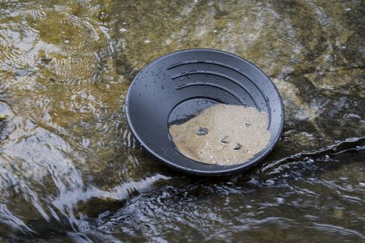 gold panning iin a small stream in northern michigan