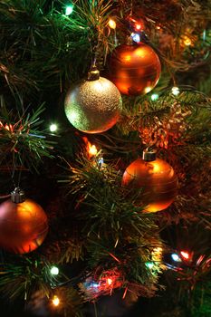 Background closeup of glass colored balls hanging on Christmas tree