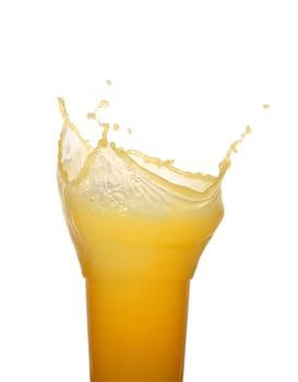 Glass of splashing orange juice isolated on white background with clipping path