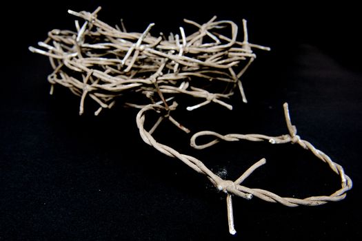 a roller barbed wire on a black background