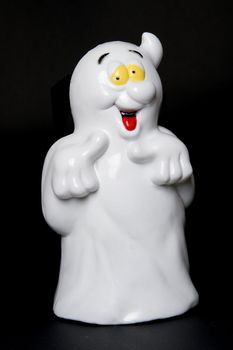 a friendly ghost on a black background