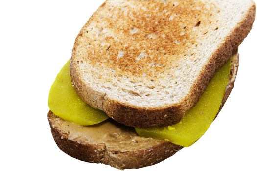 peanut butter and dill pickle sandwich on wheat bread toasted to a golden brown