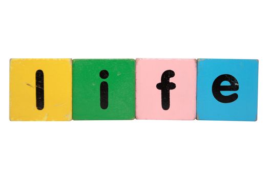 toy letters that spell life against a white background with clipping path