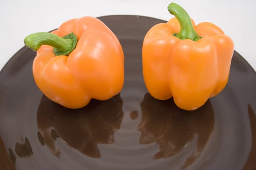 Orange peppers on a plate waiting for the salad
