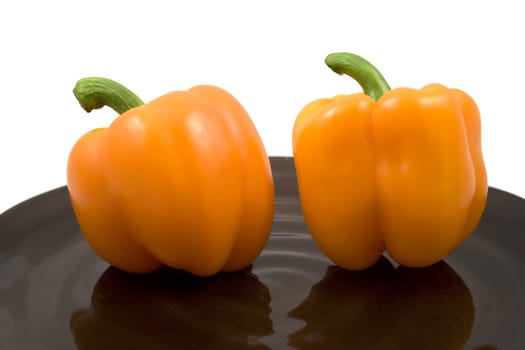 Orange peppers on a plate waiting for the salad
