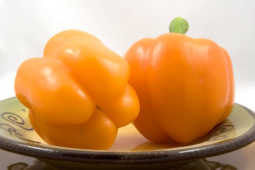 Orange peppers on a plate waiting for the salad
