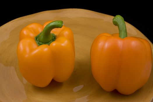 Orange peppers on a plate waiting for the salad
