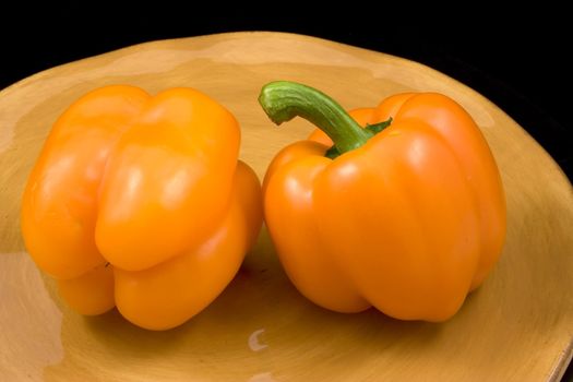 Orange peppers on a plate waiting for the salad
