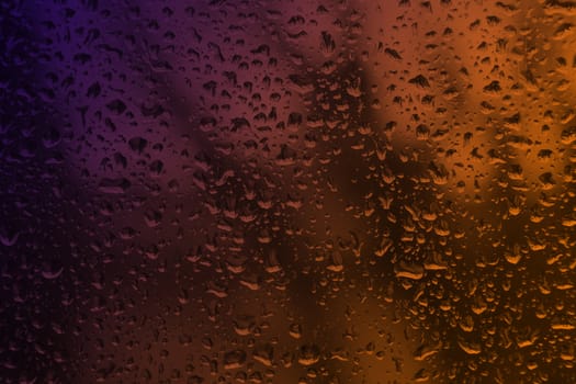 Rain drops on glass close up nice background concept