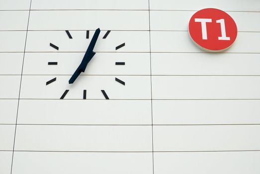 Terminal sign and clock in an airport hall