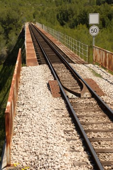 Railway track crossing a valley on a bridge