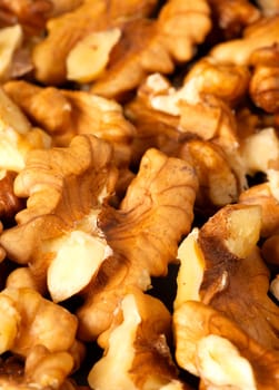 Heap of freshly shelled walnuts  as a background
