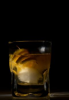 Whiskey sour cocktail isolated on black background