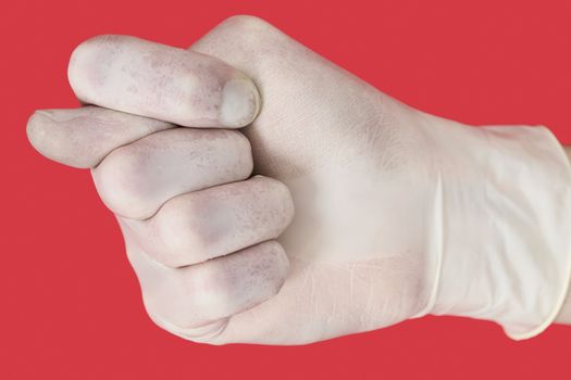 Male hand demonstration fig on the red background