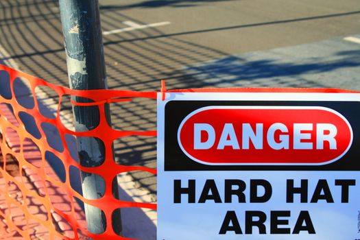 Danger hard hat area sign close up.
