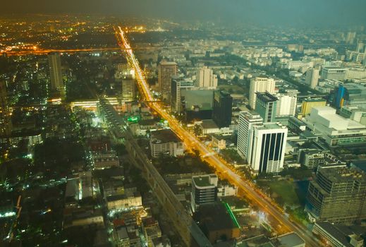 Combined image of day and night aerial view of Bangkok downtown. Thailand