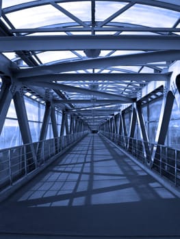 Blue toned shot of a long empty corridor.