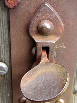 macro shot of a gate latch going rusty