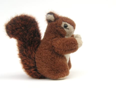 childs red squirrel furry toy isolated