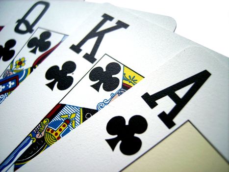 Royal Flush on a wooden table winning hand