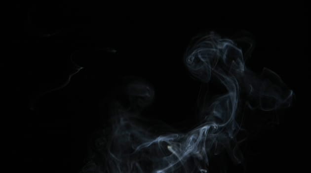 Smoke with a black background. Abstract element to help your design