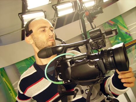 an image with a television cameraman working with camera