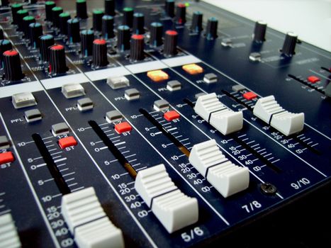 audio-mixer with yellow and white and blue buttoms