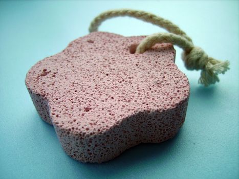 a close detail of a pink pumice stone