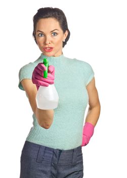 Portrait of beautiful young housewife with spray bottle. Isolated over white