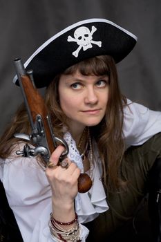 Girl - pirate on black with pistol in hand