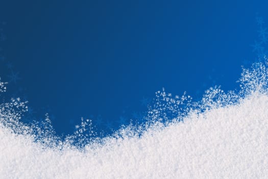 Winter background for the congratulations. The blue background and natural snow. Space for text