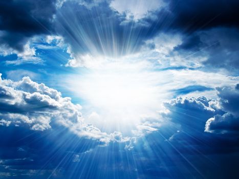 Rays of sunshine breaks through the dark clouds. �oncept of hope for the best, mood changes, enthusiasm, optimism, faith in our own strength, the breakthrough goal