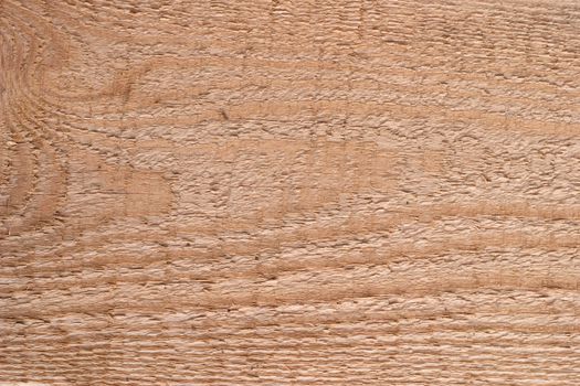 The surface of the wooden planks. One can see the fibers of the wood and traces of handling