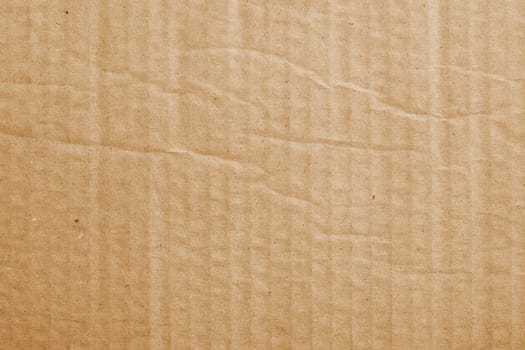 The texture of coarse packing cardboard with strips of close-ups
