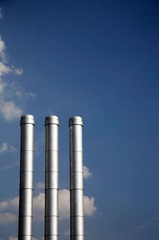 Three smokestacks of a industrial plant in Germany
