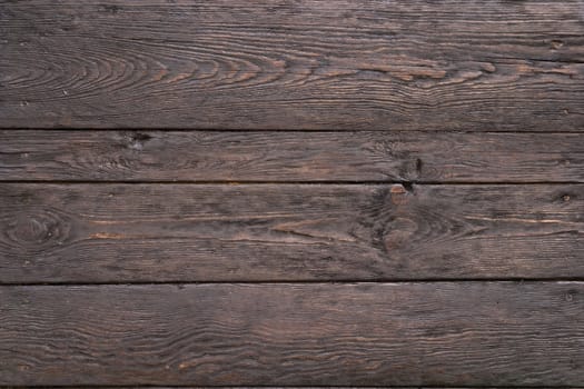 The texture of the old dark wood. Natural old embossed wooden surface, age over 20 years, covered with stains. Not an imitation