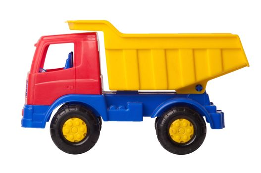 Toy truck is isolated on a white background, side view