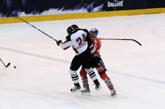 ZELL AM SEE; AUSTRIA - SEPTEMBER 4: Red Bull Salute Tournament Semifinal. Richie Regehr (Berlin) hits Caryl Neuenschwander.  Game between SC Bern and Eisbaeren Berlin (Result 1-5) on September 4, 2010.