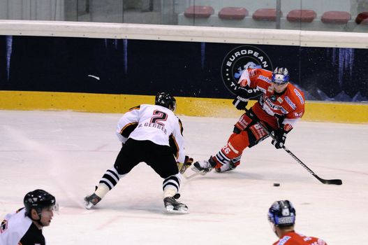 ZELL AM SEE; AUSTRIA - SEPTEMBER 4: Red Bull Salute Tournament Semifinal. Florian Busch (Berlin) attacks in Bern zone.  Game between SC Bern and Eisbaeren Berlin (Result 1-5) on September 4, 2010.